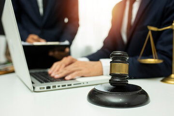 team meeting.businessman discussing legal legislation at law firm. judge gavel 