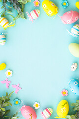 Easter background on blue. Holiday decorations with copy space.