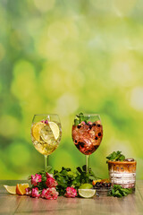 Set of cold sangria and iced coffee summer drinks on wooden table with ingredients