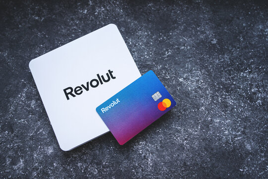 Revolut Bank card with the white envelope. New redesigned Revolut Mastercard without card details on concrete background. Krakow, Poland - November 11, 2022.