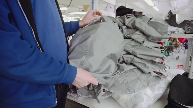 Employee checkups parachute rucksack detail in workshop