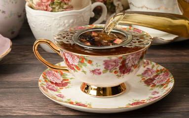 Pretty porcelain teacup with hibiscus tea