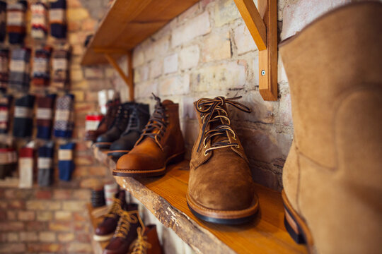 Shoes on shelves in clothing store