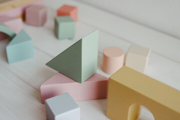 Children's wooden cubes. The concept of zero waste. Logical thinking. Wooden colorful blocks and cubes. Toys made of natural wood.