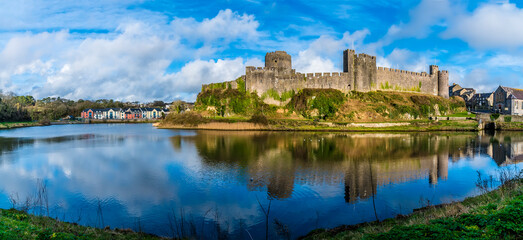 Fototapeta na wymiar A panorama view across the River Cleddau and the Norman castle at Pembroke, Wales on a bright day