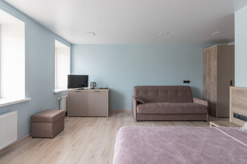 Fototapeta premium Hotel room with a large double bed in light colors