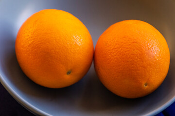 fresh ripe juicy oranges on a black background
