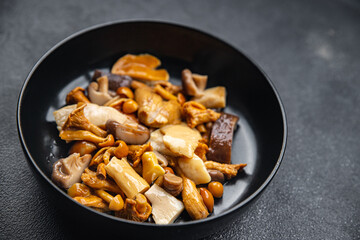 mushroom salad mix appetizer white mushroom, boletus mushroom, chanterelle mushroom, ready to eat healthy meal food snack on the table copy space food background rustic top view