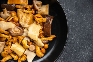 mushroom salad mix appetizer white mushroom, boletus mushroom, chanterelle mushroom, ready to eat healthy meal food snack on the table copy space food background rustic top view