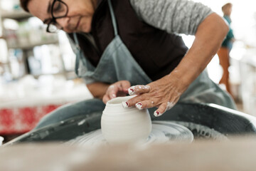 Woman making pottery