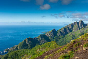 Amazing landscape of the Lofoten Islands from the top of Reinebringen Mountain with blue sky , Norway