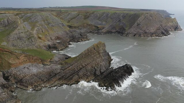 Aerial of The Knave along the dramatic coast of the Gower Peninsula, Wales, United Kingdom, Europe