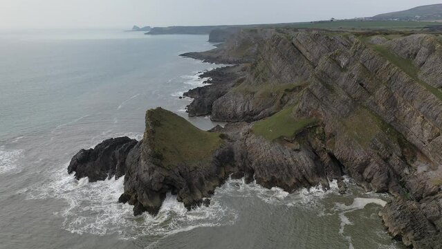 Aerial of The Knave along the dramatic coast of the Gower Peninsula, Wales, United Kingdom, Europe