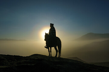 Fototapeta na wymiar Man with horse in Mount Bromo, East java