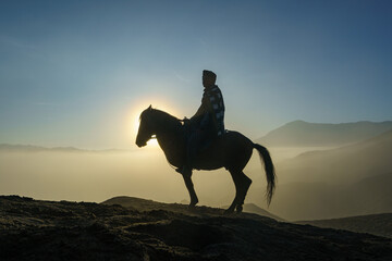 Man with horse in Mount Bromo, East java