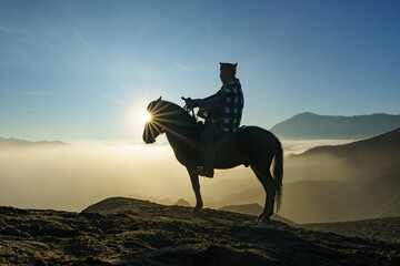 Obraz na płótnie Canvas Man with horse in Mount Bromo, East java