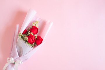 Bouquet of Red rose flowers with white flowers decorated on pink background, Bouquet flowers for Valentines and special days