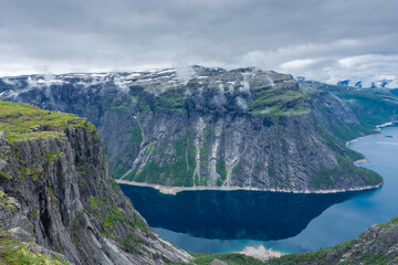 Naklejka na ściany i meble Amazing cliff over the Ringedalsvatnet lake in Trolltunga mounatin area, Norway
