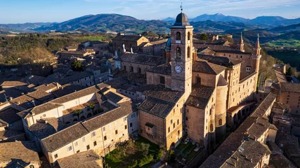Foto op Canvas One of the most beautiful medieval towns of Italy - Urbino in Marche region. aerial drone panoramic high angle view over sunset © Freesurf