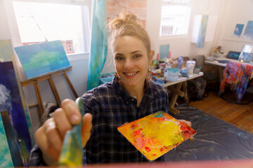 Portrait of Female Artist Works on Abstract Oil Painting, Moving Paint Brush Energetically She Creates Modern Masterpiece.