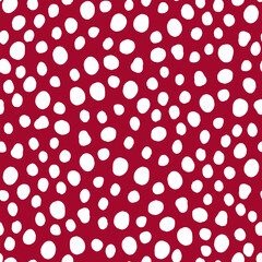 Seamless neutral polka dots pattern. White hand-drawn circles on a red background. Abstract Random points ornament. Vector bright illustration for wallpaper, fabric, print, wrapping paper, textile