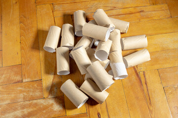 lots of toilet paper roll sleeves on the floor