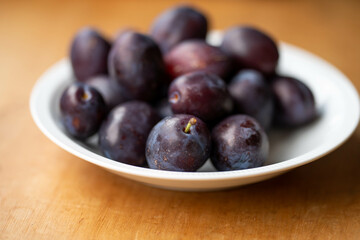 bowl of fruit, plums and apricot