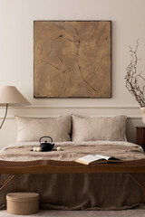 Bedroom interior with mock up poster frame, bed, beige bedding, wooden bench, lamp, vase with...