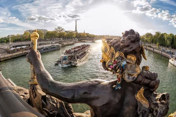 Photo sur Plexiglas Pont Alexandre III The Pont Alexandre III (bridge) with sculptures against tourist boat on Seine and Eiffel Tower in Paris, France