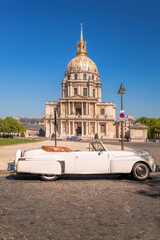 View of Les Invalides with vintage car (Lincoln) in Paris, France - 585780513