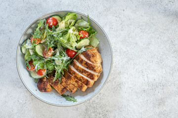 Green salad with grilled chicken breast. Healthy food, clean eating concept