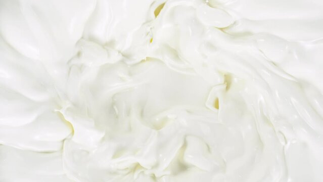 Super slow motion of whirling milk cream. Filmed on high speed cinema camera, 1000fps.