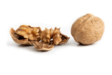 Walnut with cracked shell. Close-up picture of dried fruits isolated on white backgroud.