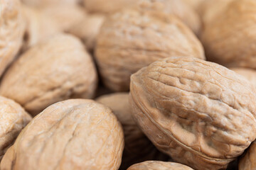 Bunch of walnuts. Close-up picture of many dried fruits.