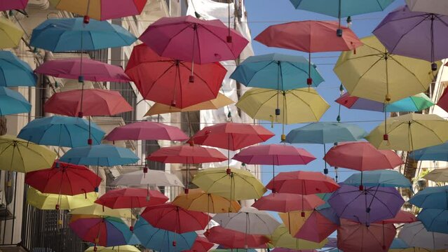 Colourful umbrellas hanging in street over alfresco restaurants near Duomo, Catania, Sicily, Italy, Mediterranean, Europe