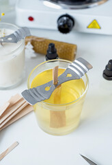 closeup of wooden wick in handmade candle