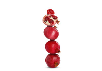 Stack of pomegranate fruits on white background