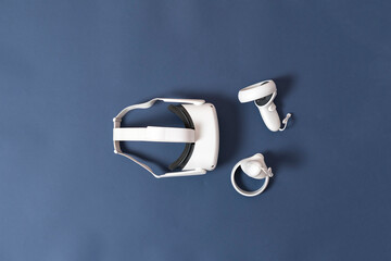 set of virtual reality with headset and controllers flat lay, digital technilogy concept