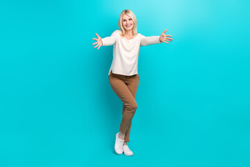 Fototapeta na wymiar Full length photo of pretty excited lady dressed white shirt open arms ready hug you isolated teal color background