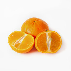 Fototapeta na wymiar Fresh tangerine or orange with slices on a white background. Isolated