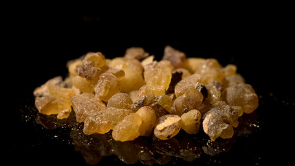 close up view of organic Frankincense Resin isolated on black