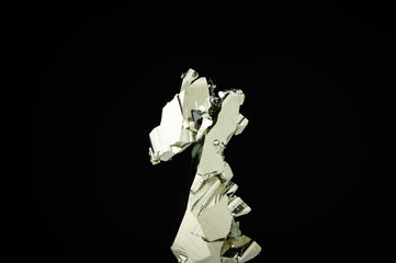 Pyrite crystal on black background. macro detail texture background. close-up raw rough unpolished...