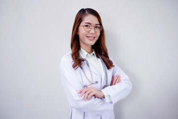 Smiling Asian female doctor with arms crossed medical concept.