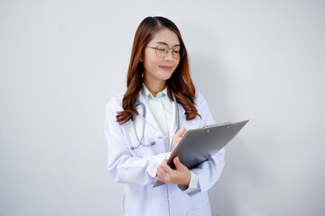 Smiling Asian female doctor holding clipboard medical concept.