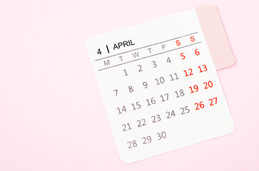 A Mini April calendar on a pink color background. High resolution and copy space for all your text or message.