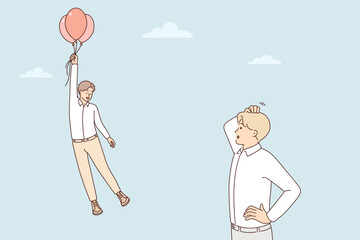 Frustrated man look at colleague flying on balloons 
