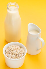 Oat milk. Healthy vegan non-dairy organic drink with flakes