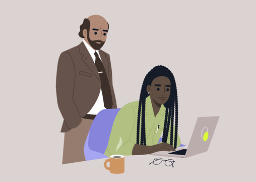 A senior manager supervising an intern in the office