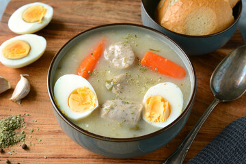 The sour soup (zurek) made of rye flour with sausage and egg. Popular Easter dish