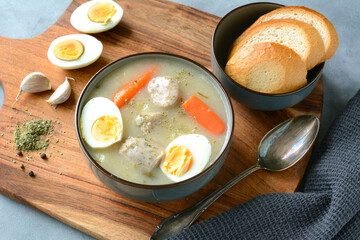 The sour soup (zurek) made of rye flour with sausage and egg. Popular Easter dish